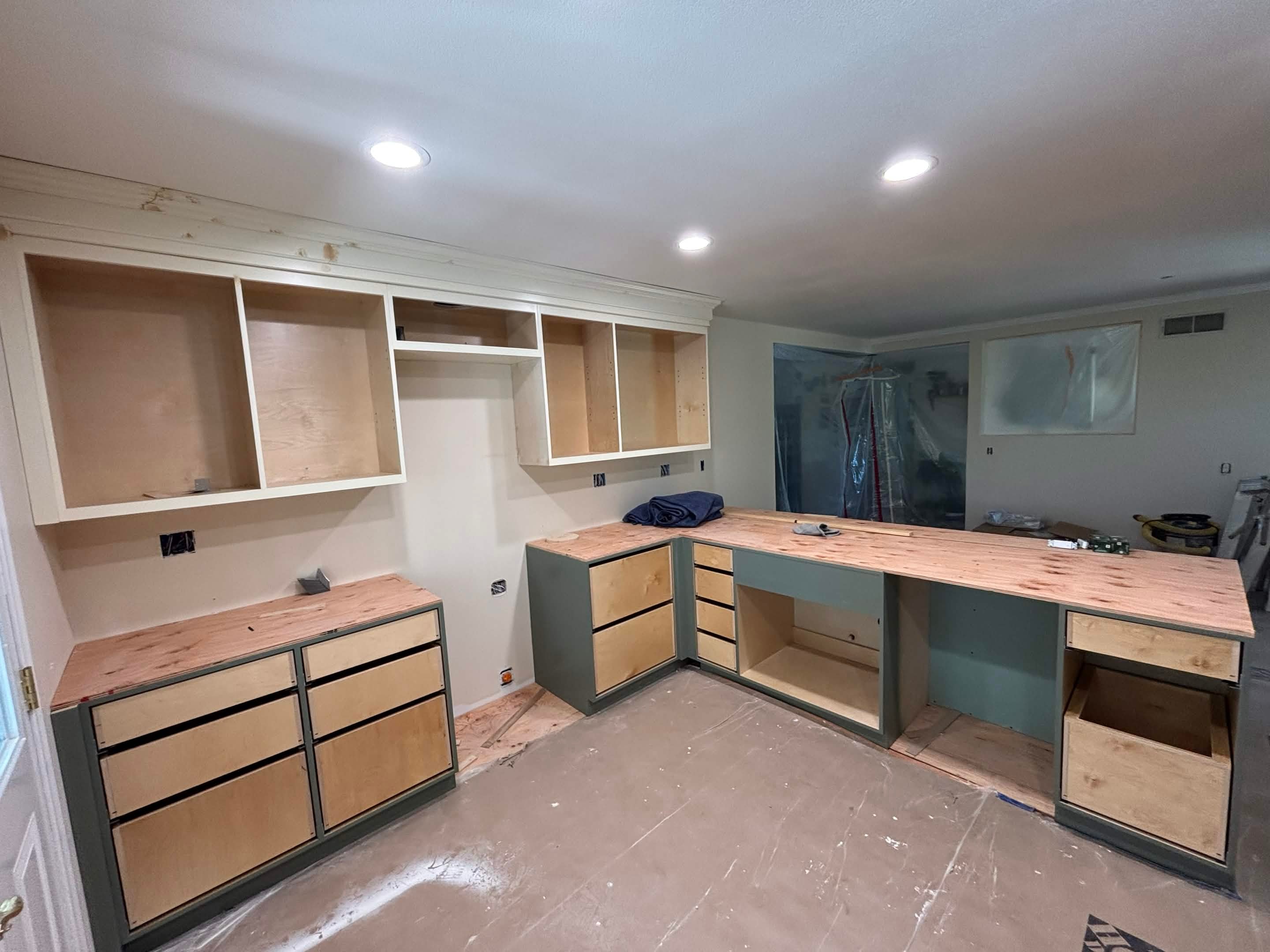 Kitchen remodel — progress view showing new cabinetry installation